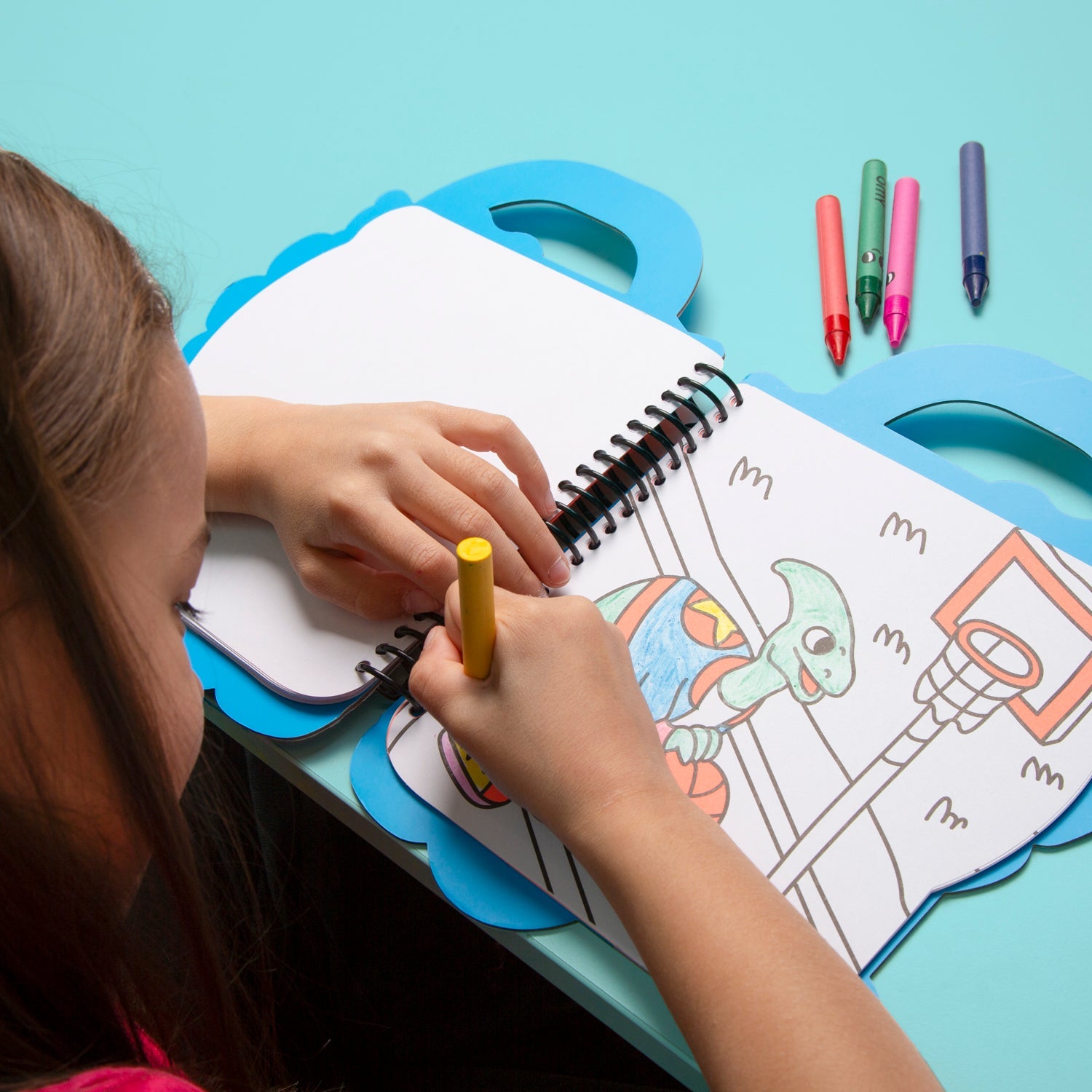 OMY Dino Coloring & Sticker Book in use