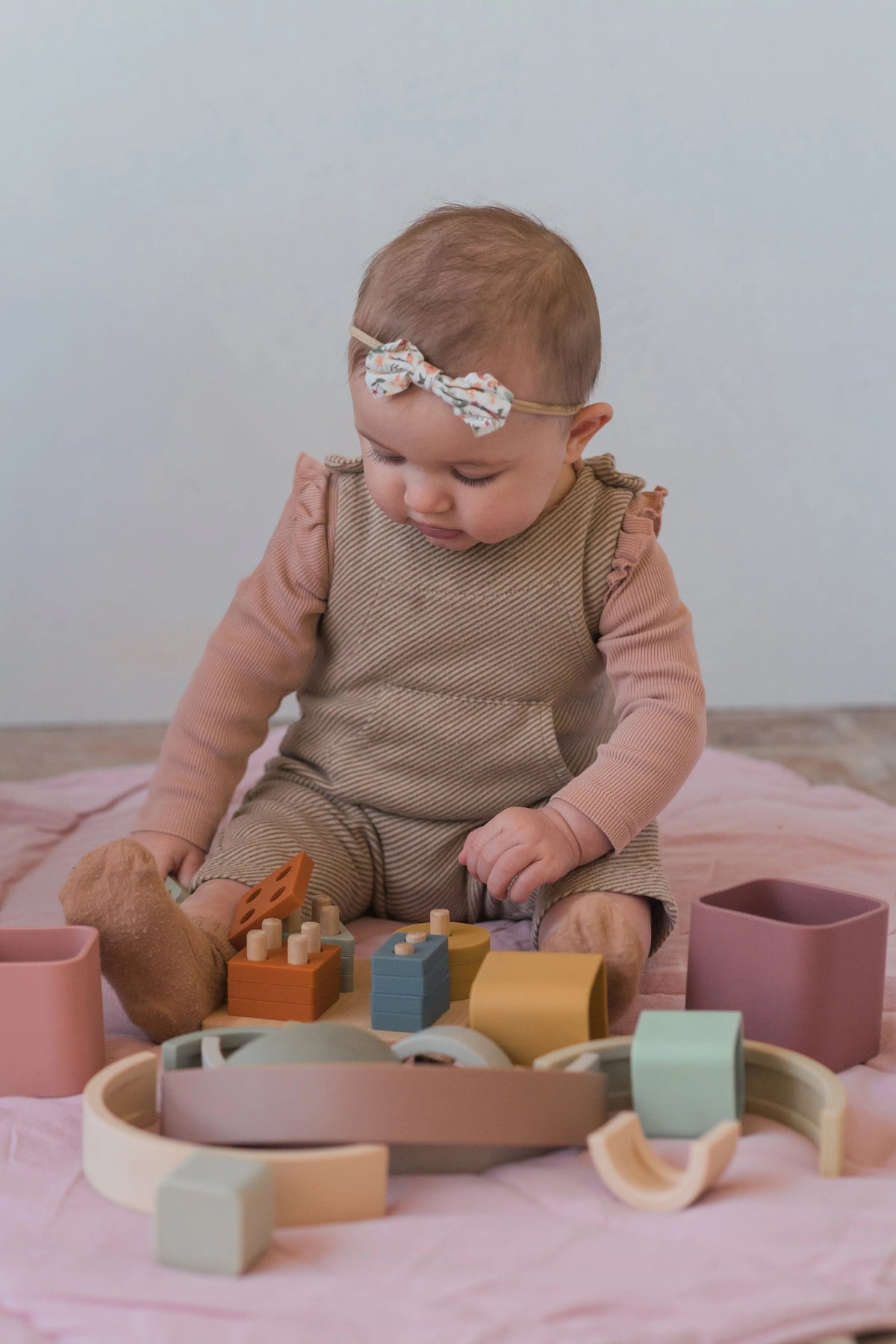 Toddler playing with LYTL Birthday Bundle toys